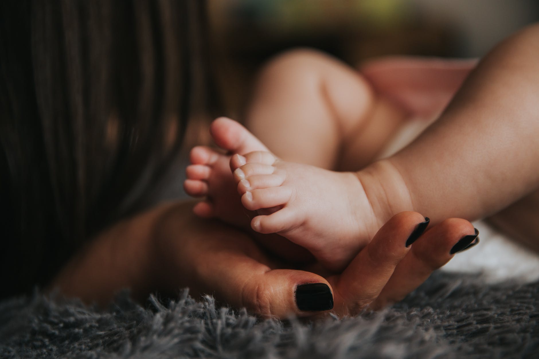 pexels-mother-holding-baby-feet